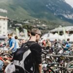 man in black jacket riding bicycle during daytime